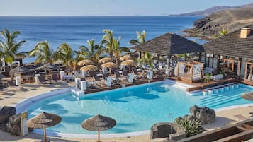 4 outdoor pools, open 9:00 AM to 8:00 PM, pool umbrellas, sun loungers