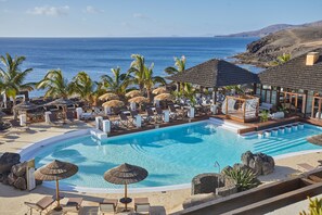 4 outdoor pools, open 9:00 AM to 8:00 PM, pool umbrellas, sun loungers