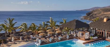 4 outdoor pools, open 9:00 AM to 8:00 PM, pool umbrellas, sun loungers