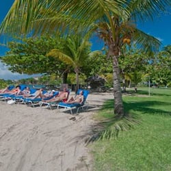 On the beach, white sand, sun loungers, beach umbrellas