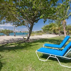 On the beach, white sand, sun loungers, beach umbrellas