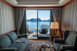 Junior Suite, with lake view | Living area | Flat-screen TV