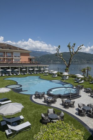 Indoor pool, seasonal outdoor pool, pool umbrellas, pool loungers