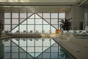 Indoor pool, open 6:00 AM to 10:00 PM, pool loungers, lifeguards on site