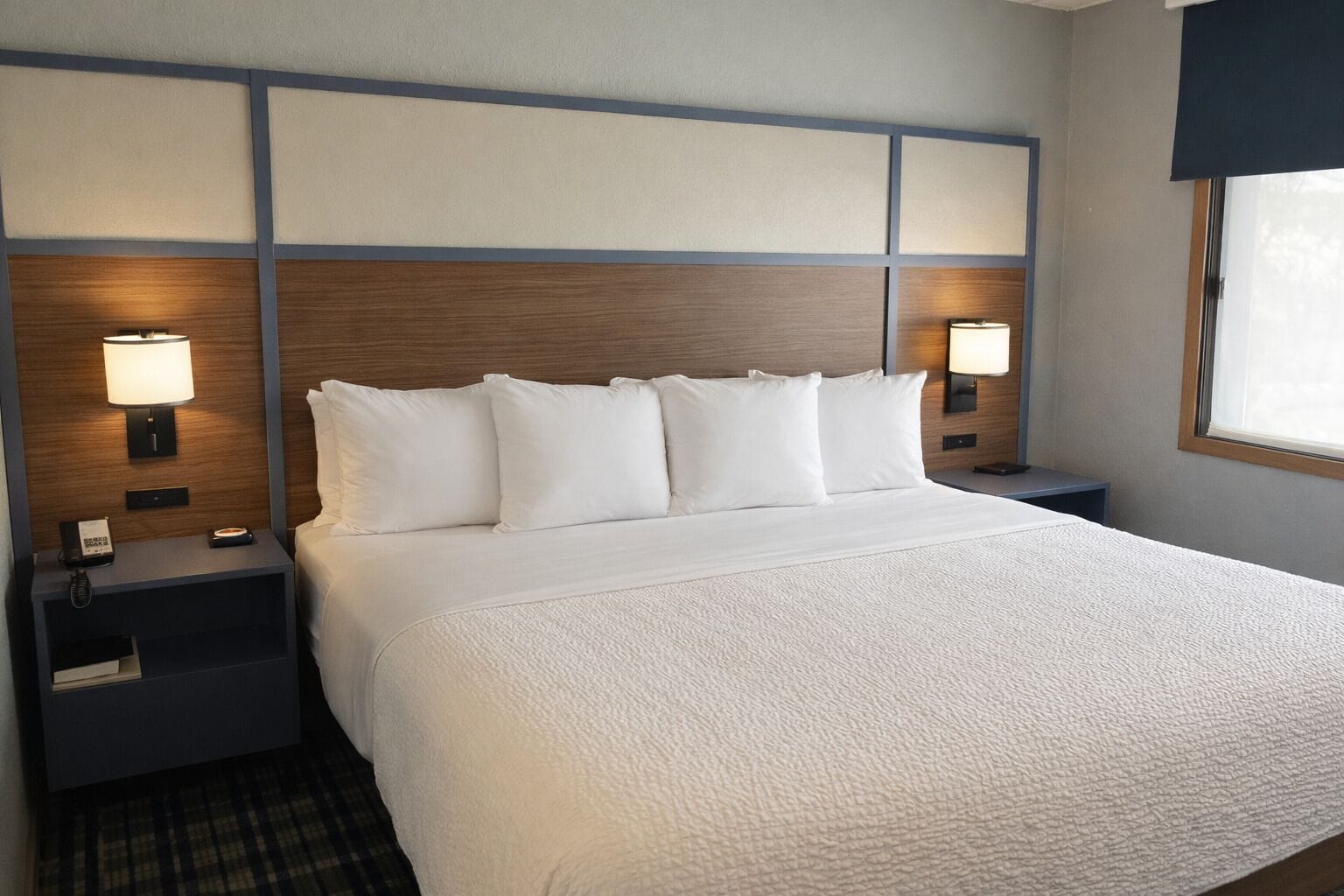 Premium bedding, desk, laptop workspace, blackout curtains