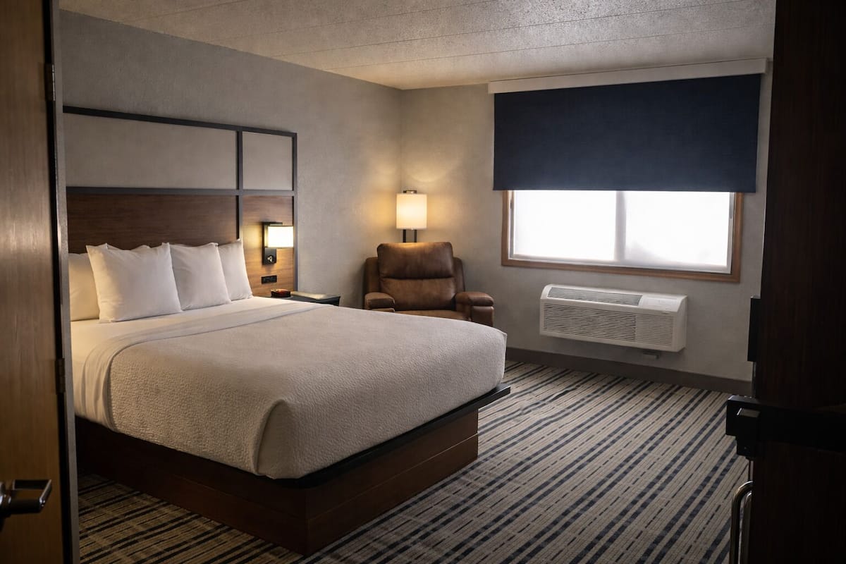 Premium bedding, desk, laptop workspace, blackout curtains