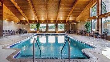 Relax by the pool surrounded by lush greenery and take in the breathtaking views of the surrounding landscape.
