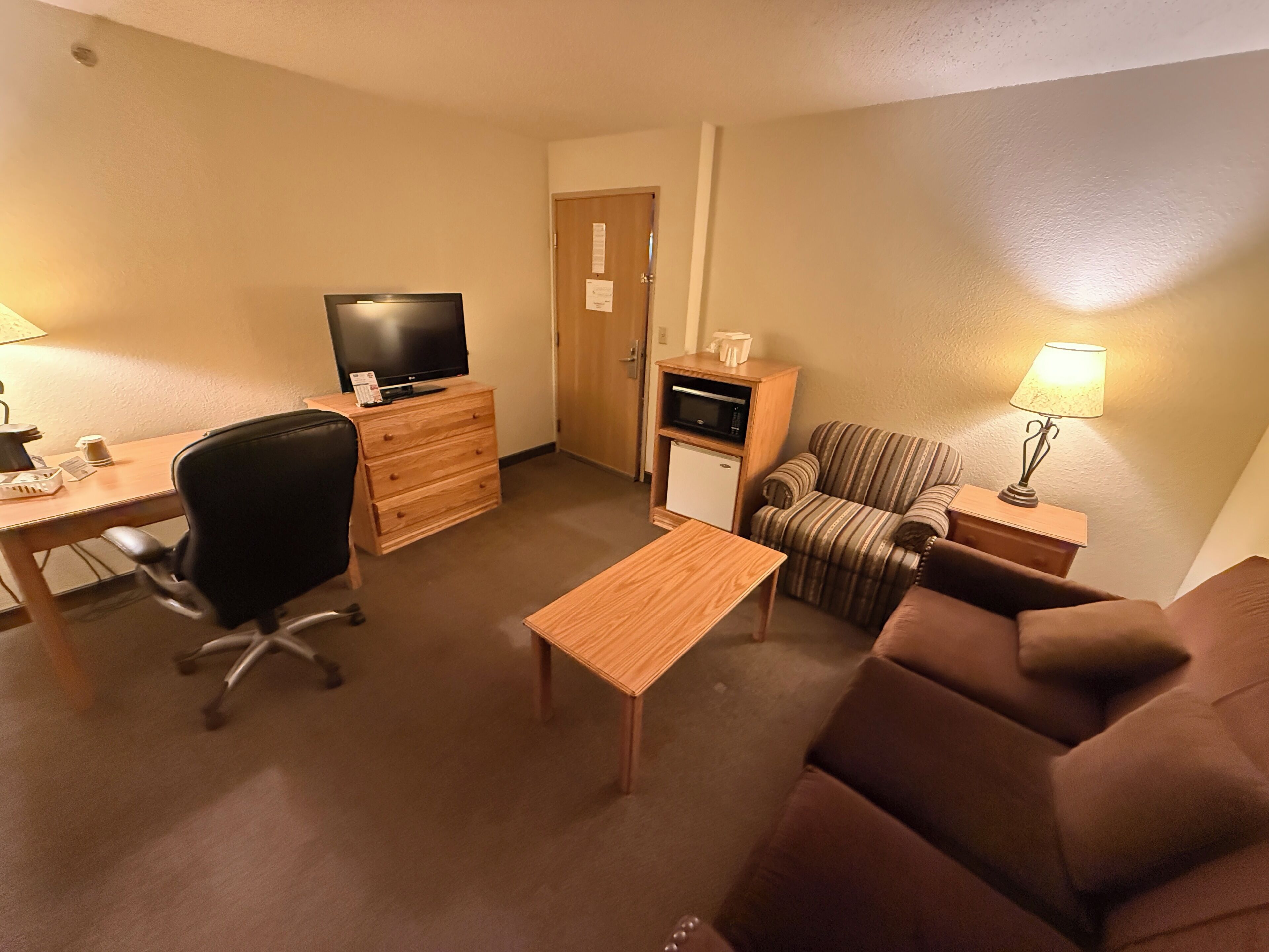 suite, 1 king bed with sofa bed, non smoking | desk, laptop workspace, iron/ironing board, free wifi