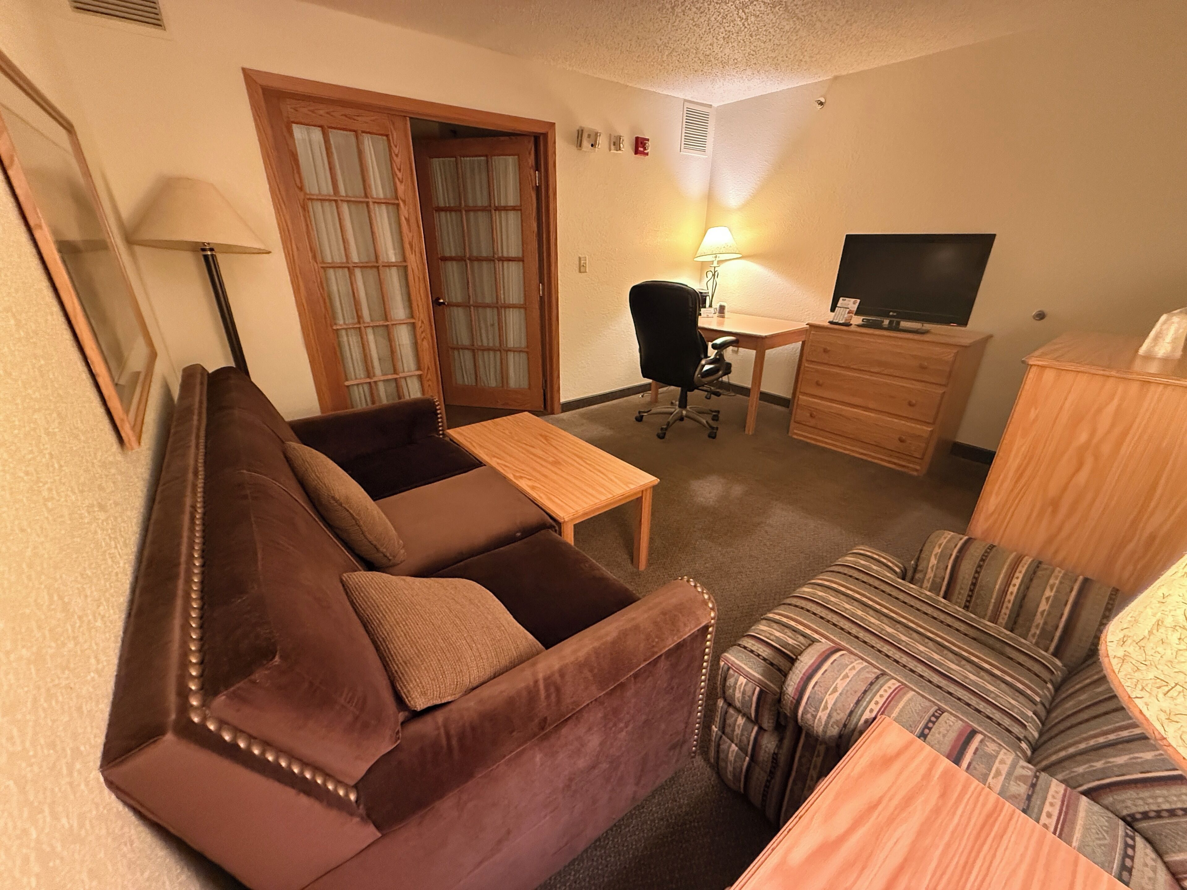 suite, 1 king bed with sofa bed, non smoking | desk, laptop workspace, iron/ironing board, free wifi