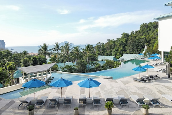 Outdoor pool, pool umbrellas, sun loungers