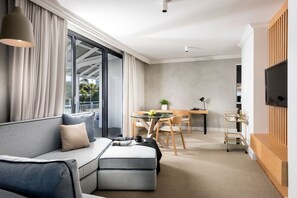 River Suite | Living area | 32-inch TV with cable channels, pay movies - Tradewinds Hotel Fremantle (East Fremantle)