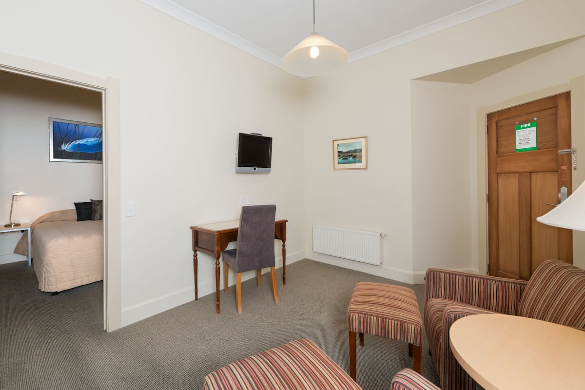 Suite, 1 Bedroom | Living area | TV