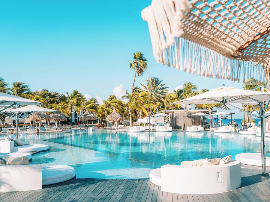 3 outdoor pools, open 8:00 AM to 8:00 PM, pool umbrellas, pool loungers