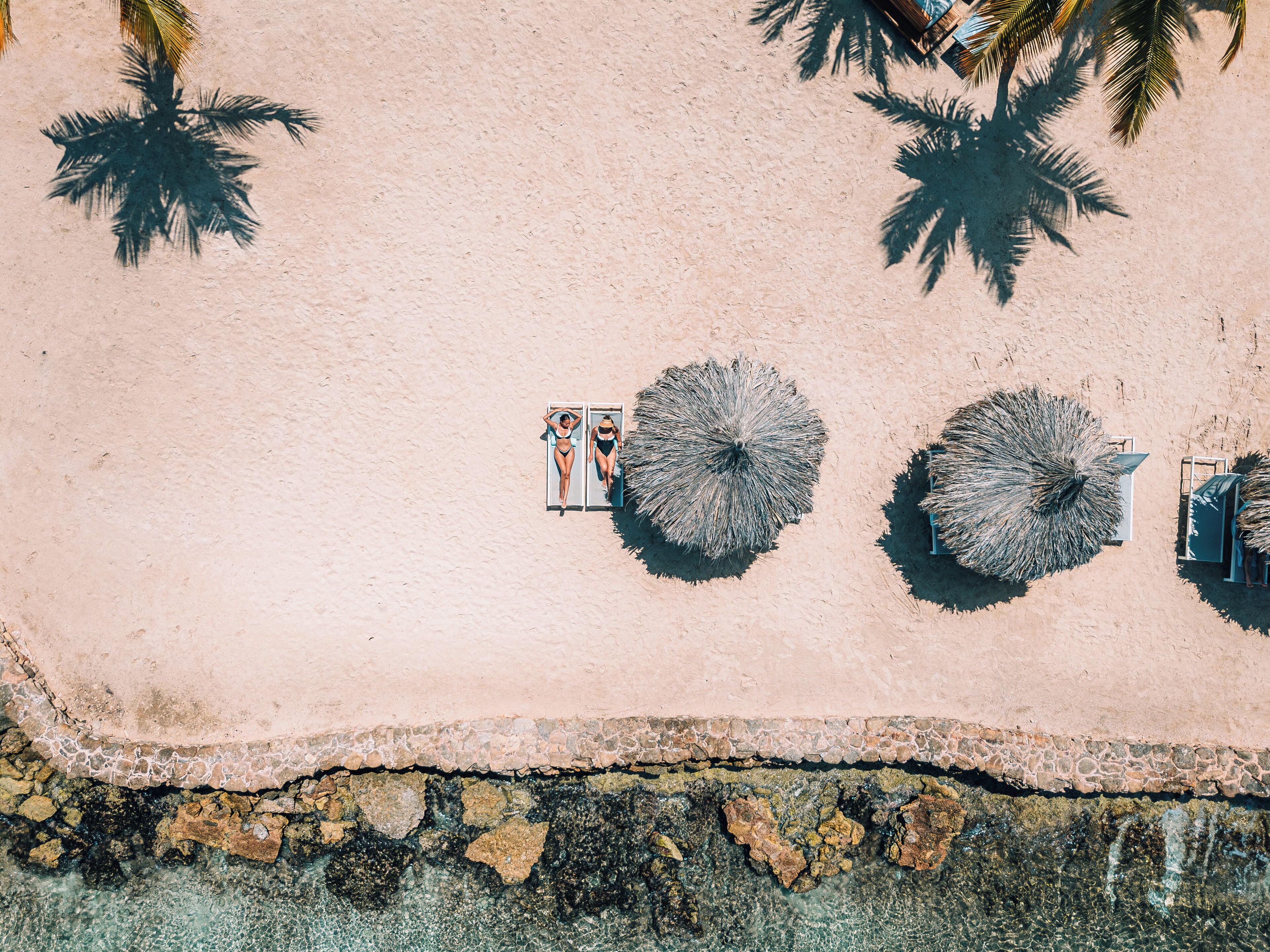private beach, white sand, sun-loungers, beach umbrellas