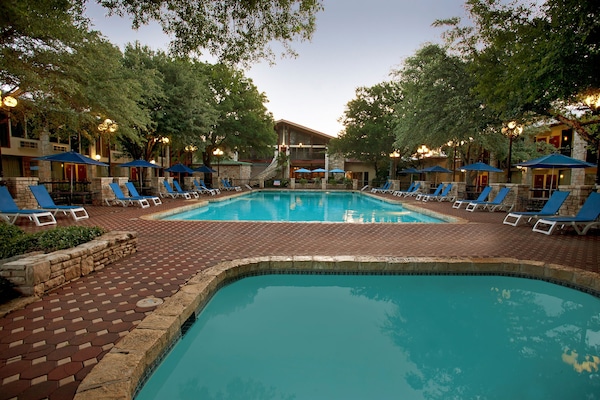 2 outdoor pools, open 10:00 AM to 10:00 PM, pool umbrellas