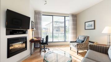 Suite, 2 Bedrooms | Living area | 40-inch flat-screen TV with cable channels, TV, iPod dock