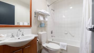 A modern bathroom with a sink, toilet, and shower.