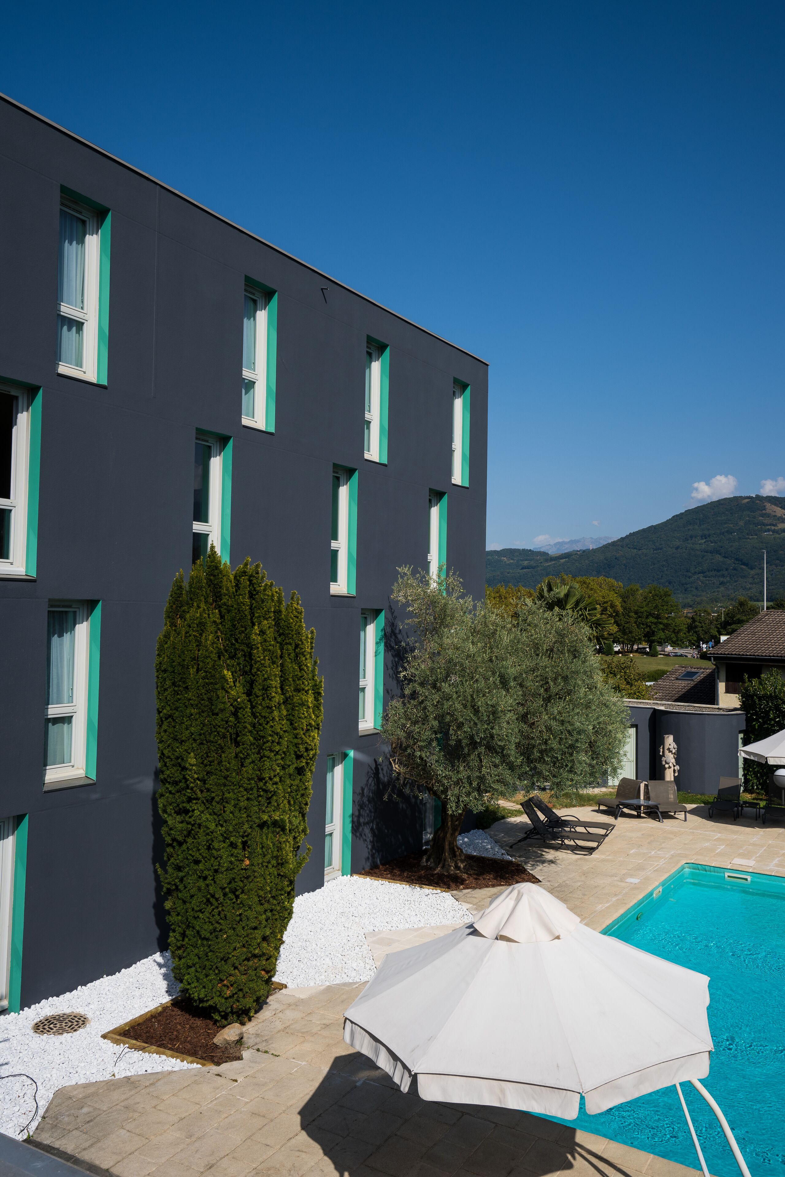 seasonal outdoor pool, pool umbrellas, pool loungers