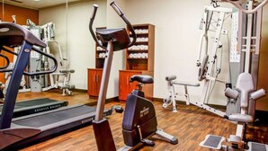 A gym with cardio machines, weight training equipment, and a mirrored wall. - Comfort Suites Gadsden Attalla (Attalla)