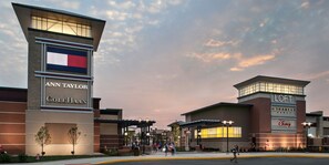 A shopping mall entrance with signs for 'Ann Taylor' and 'Cole Haan' stores. - Comfort Inn & Suites Chesterfield - St. Louis (Chesterfield)