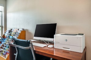 A desk with a desktop computer, a printer, and a chair. - Comfort Inn & Suites Chesterfield - St. Louis (Chesterfield)