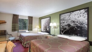 A hotel room with two beds, a desk, a chair, a window with curtains, and a large framed picture on the wall.