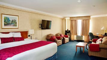 Suíte executiva, 1 cama King e sofá-cama, para não fumantes, banheira de hidromassagem | 1 quarto, escrivaninha, espaço de trabalho para notebook