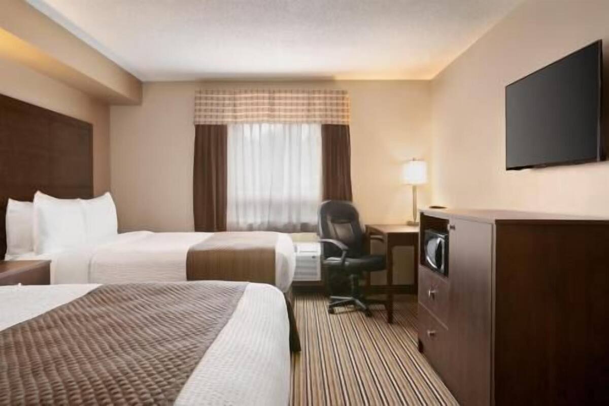 Desk, blackout curtains, iron/ironing board, rollaway beds