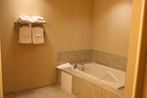 Suite, 1 King Bed, Non Smoking | Bathroom | Hair dryer, towels