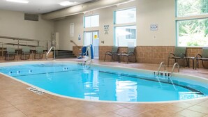 An indoor swimming pool with clear lane markings, a lifeguard chair, and a pool ladder. - Holiday Inn Express Ludlow by IHG (Ludlow)
