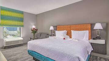 Premium bedding, desk, laptop workspace, blackout drapes