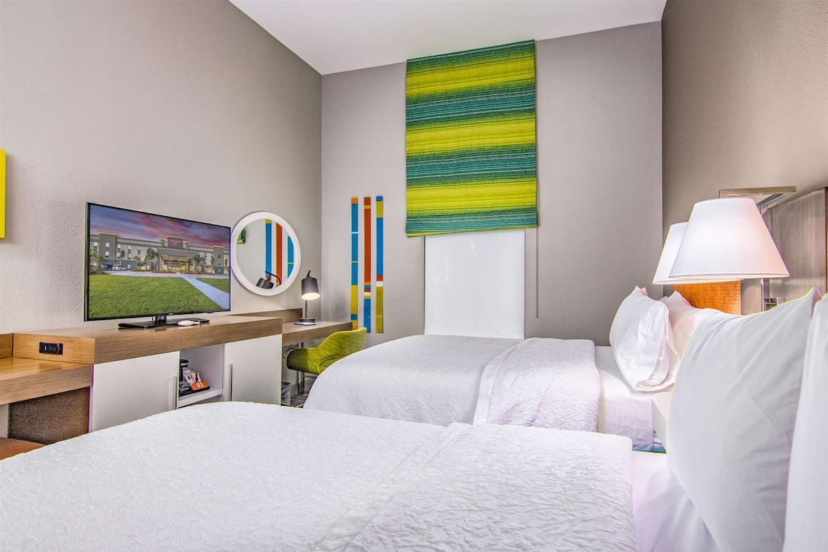 premium bedding, desk, laptop workspace, blackout curtains