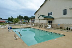 Outdoor pool, open 10:00 AM to 8:00 PM, pool umbrellas, pool loungers