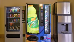 A vending machine with a Gatorade advertisement and a water dispenser. - Star City Inn & Suites (Star City)