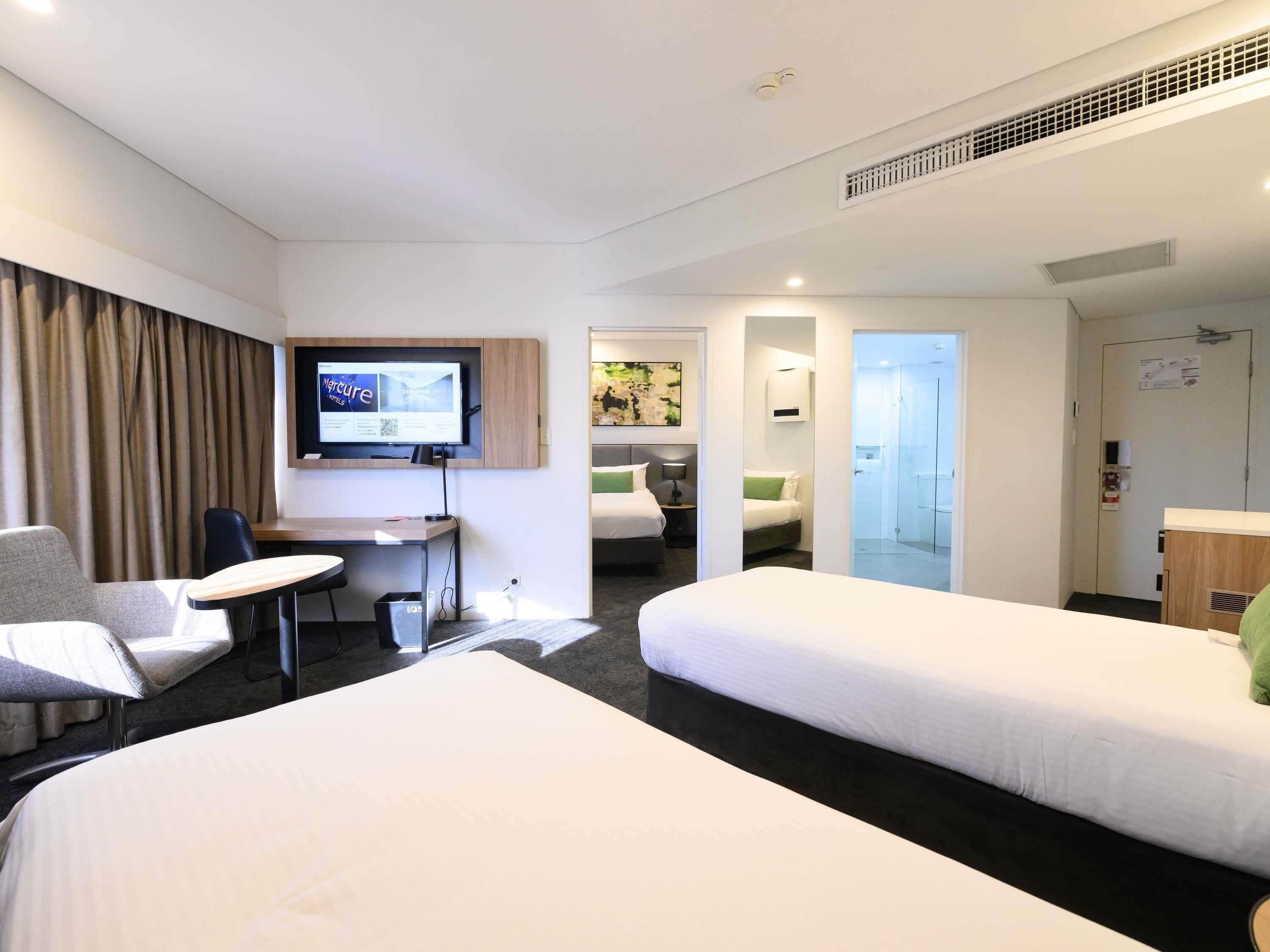 Deluxe Room (1 Queen Bed and 2 Twin Beds) | In-room safe, desk, soundproofing, iron/ironing board