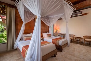 Deluxe Bungalow | Minibar, in-room safe, desk, blackout drapes