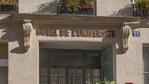 A building with a sign reading "HOTEL DE L'UNIVERSITE". - Hotel De L'Universite (Paris)