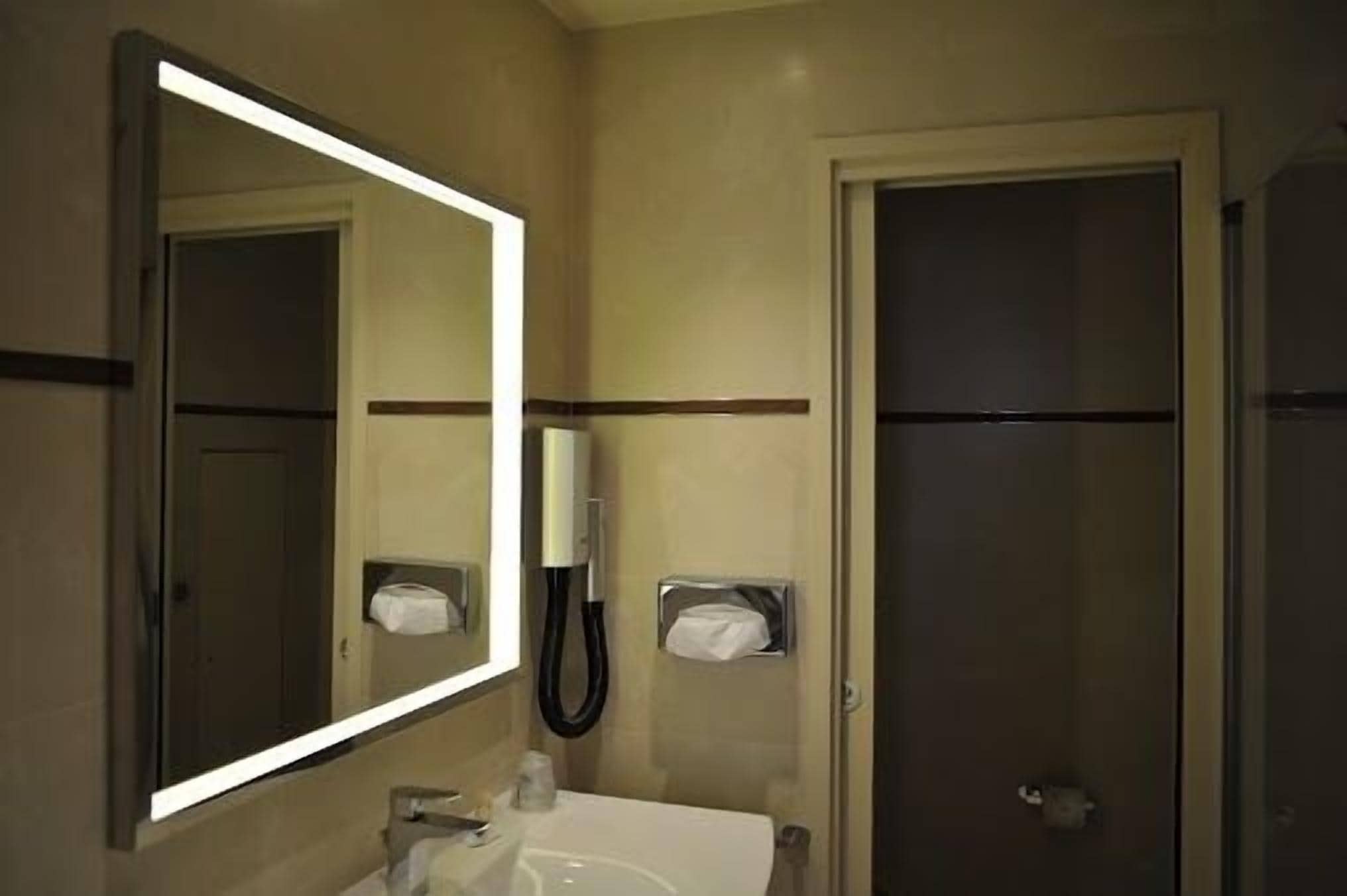 superior room | bathroom | shower, hair dryer, towels