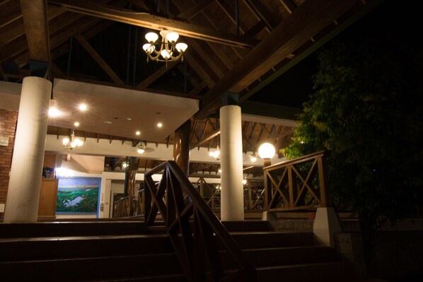 A staircase with wooden railings leading to a lower level.