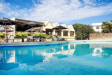 Outdoor pool, open 10:00 AM to 7:00 PM, pool umbrellas, sun loungers