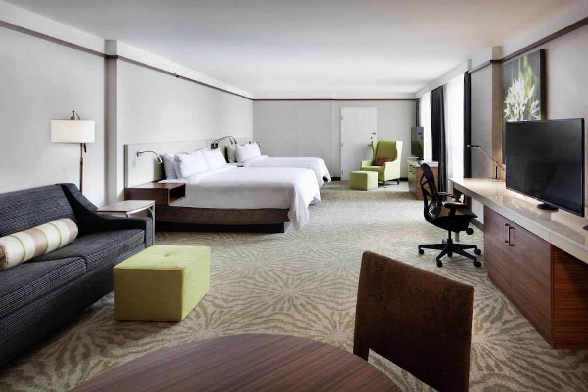 junior suite, multiple beds | living area | 42-inch flat-screen tv with satellite channels, tv, pay films