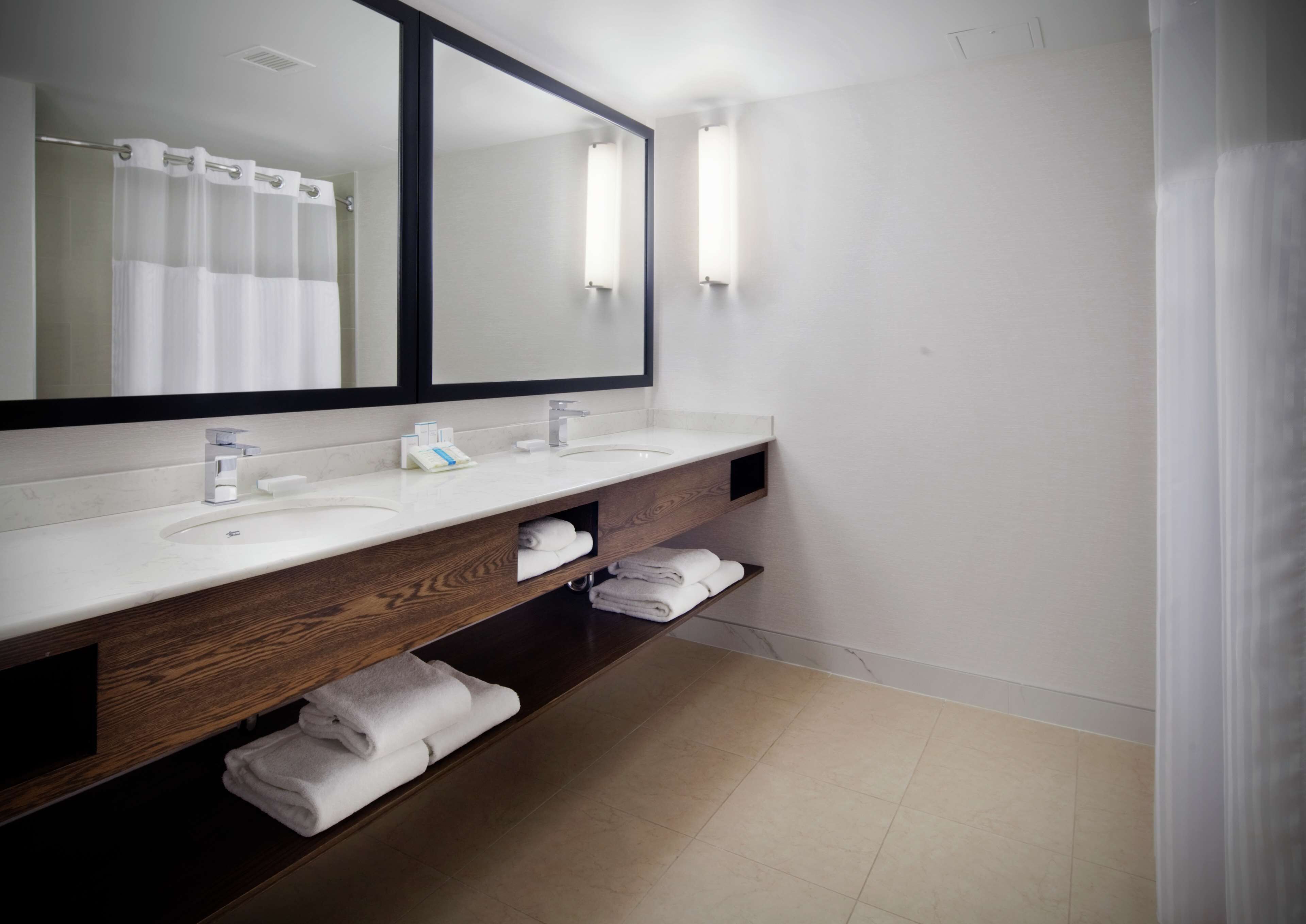junior suite, multiple beds | bathroom | free toiletries, hair dryer, towels