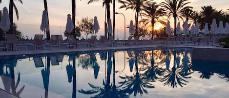 Indoor pool, pool umbrellas, pool loungers