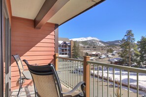 Enjoy breathtaking views of the surrounding mountains from this balcony.