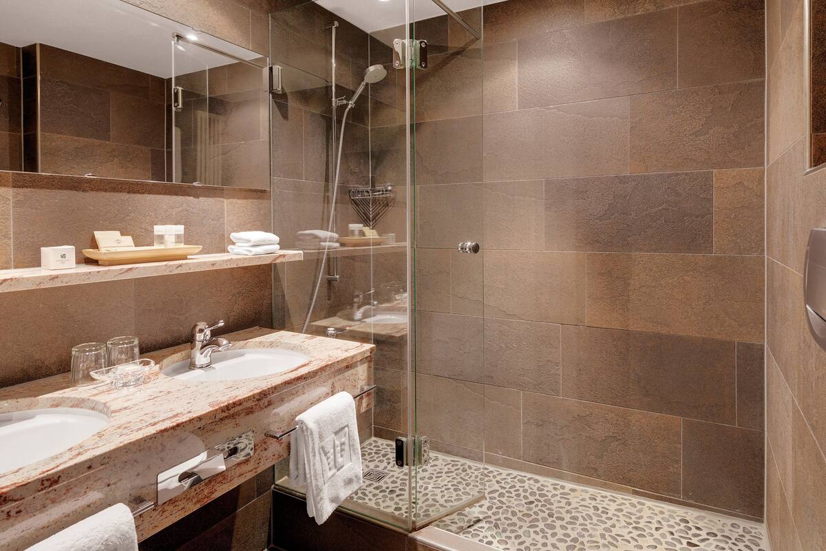 hair dryer, bathrobes, slippers, towels