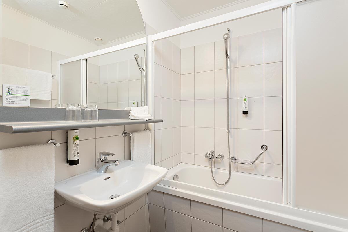 family room, 2 bedrooms, lake view | bathroom | shower, hair dryer, towels