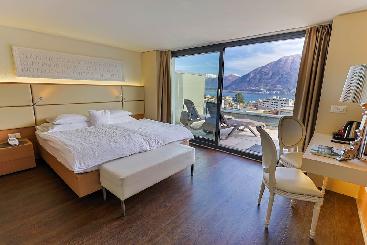 panorama double room, balcony | minibar, in-room safe, desk, iron/ironing board