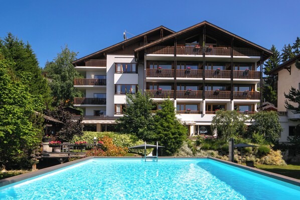 Outdoor pool, pool umbrellas, pool loungers