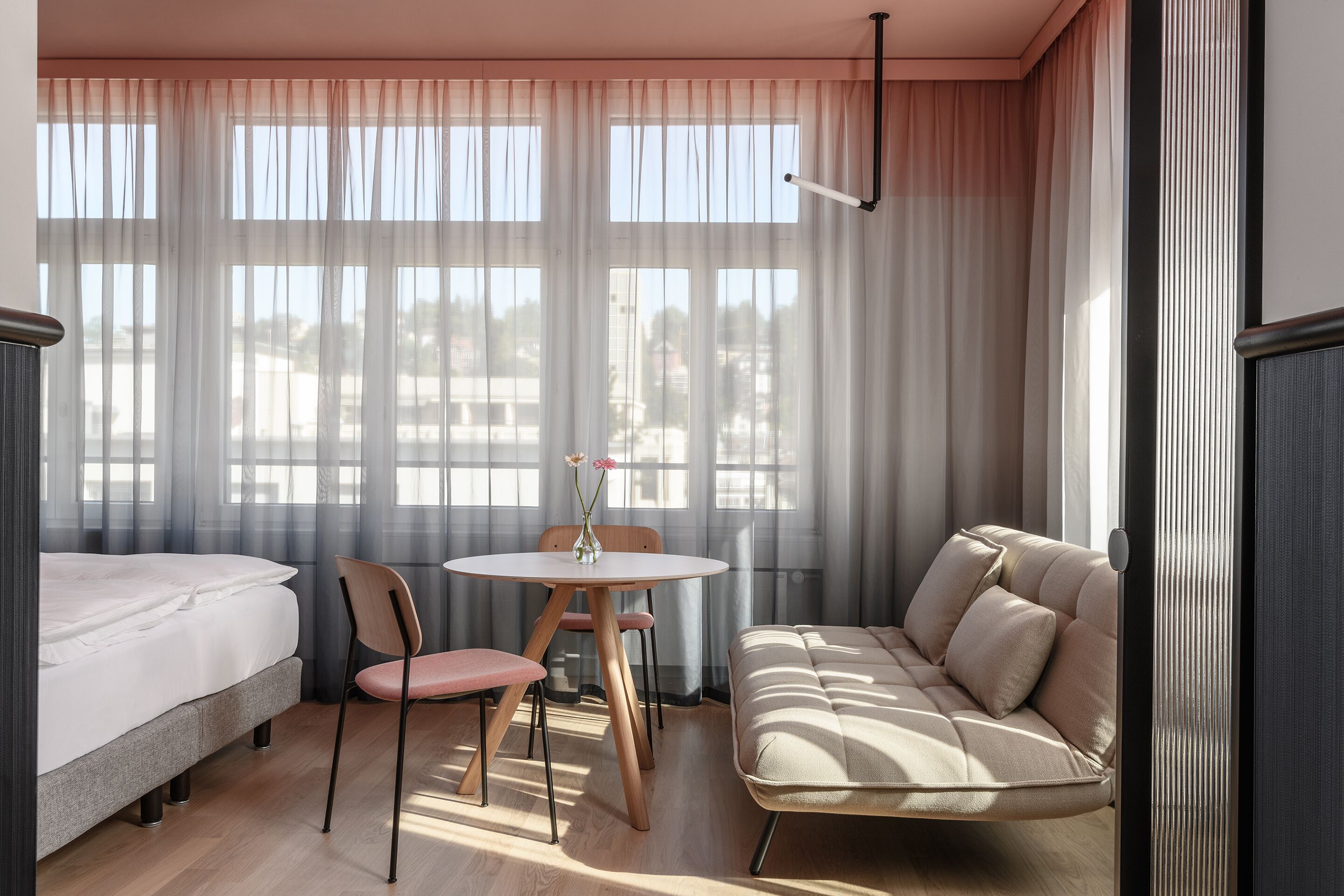 deluxe double room | living area | flat-screen tv