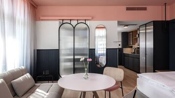 Deluxe Double Room | Living area | Flat-screen TV